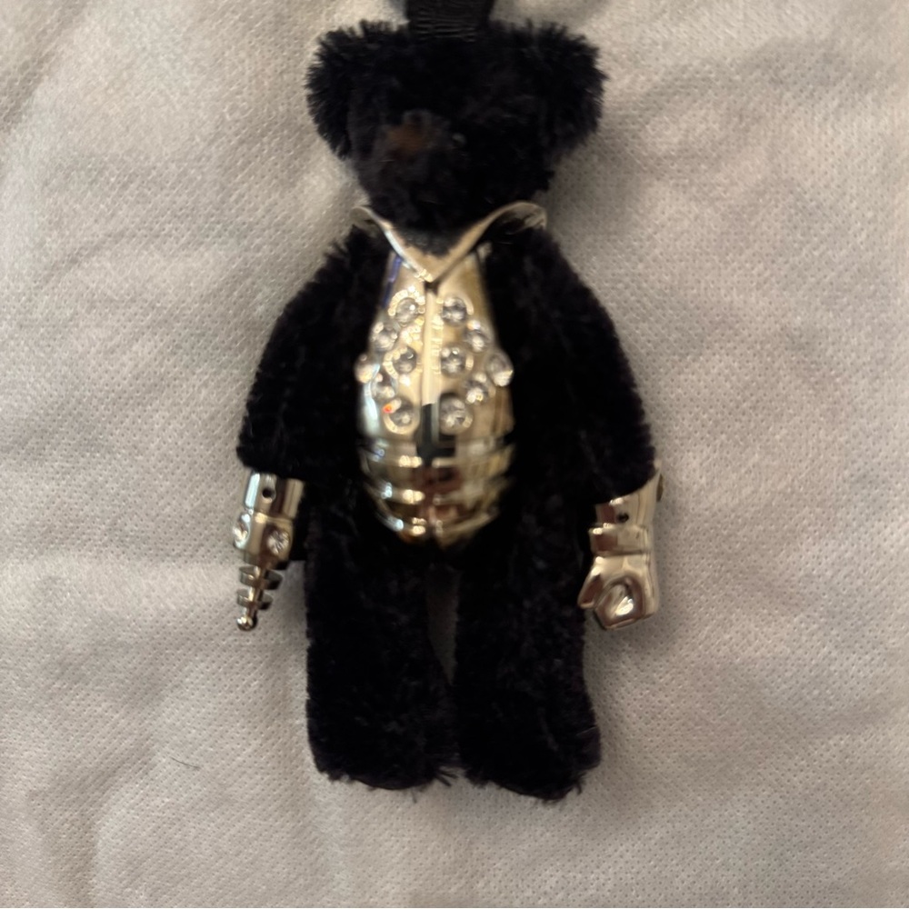 This is the cutest , (seriously), adorable PRADA teddy charm  .